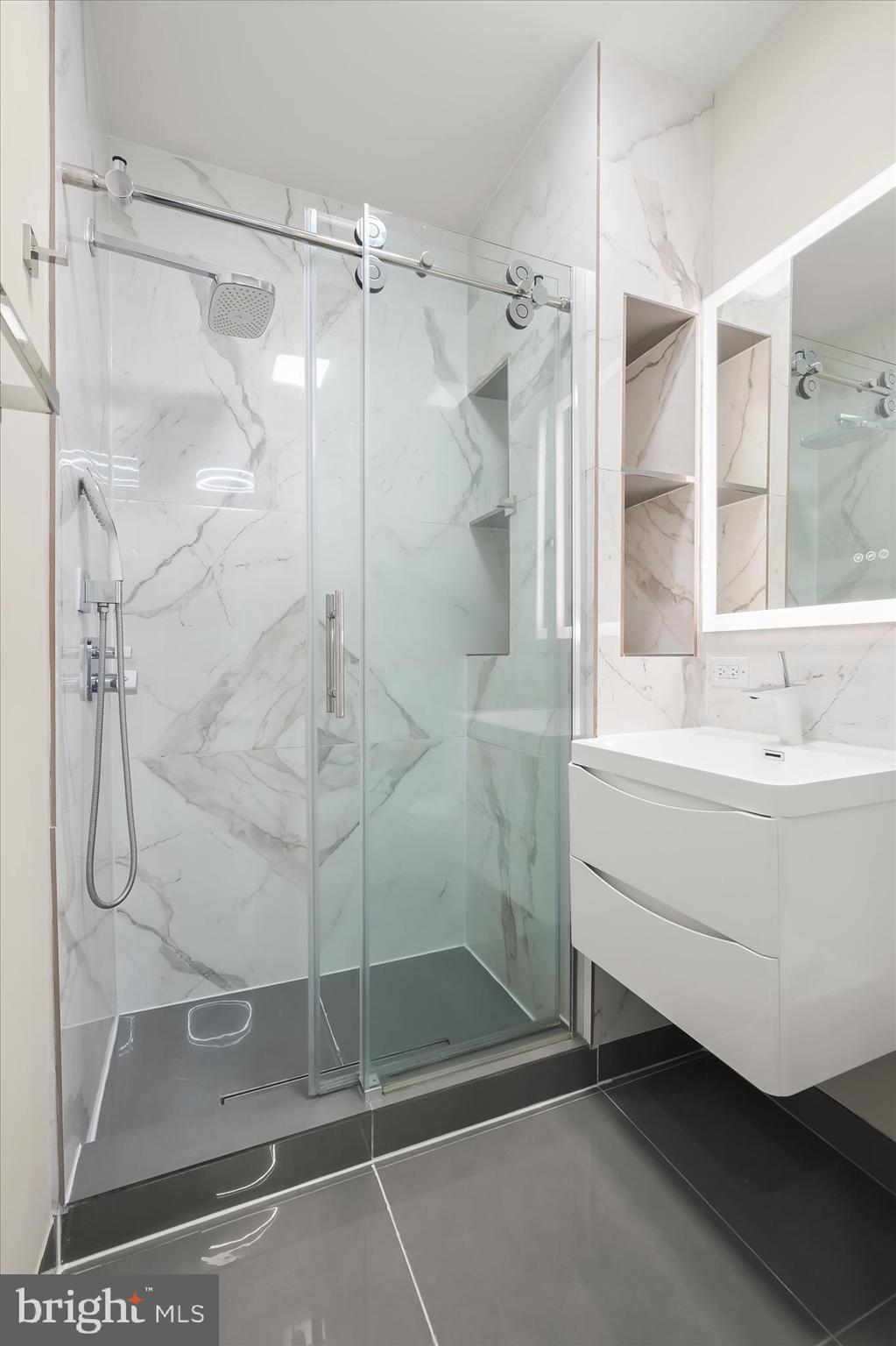 11678 Frederick Road Ellicott City, MD 21042 - Photo 57 of 118 a bathroom with a shower and a sink