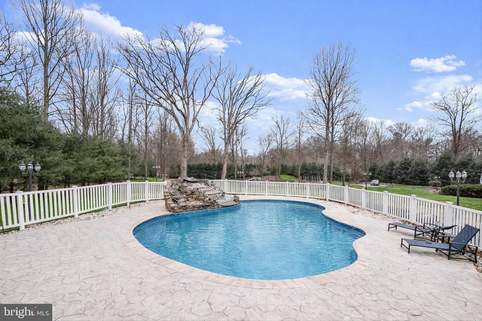 11678 Frederick Road Ellicott City, MD 21042 - Photo 98 of 118 a view of a swimming pool with a patio and a yard