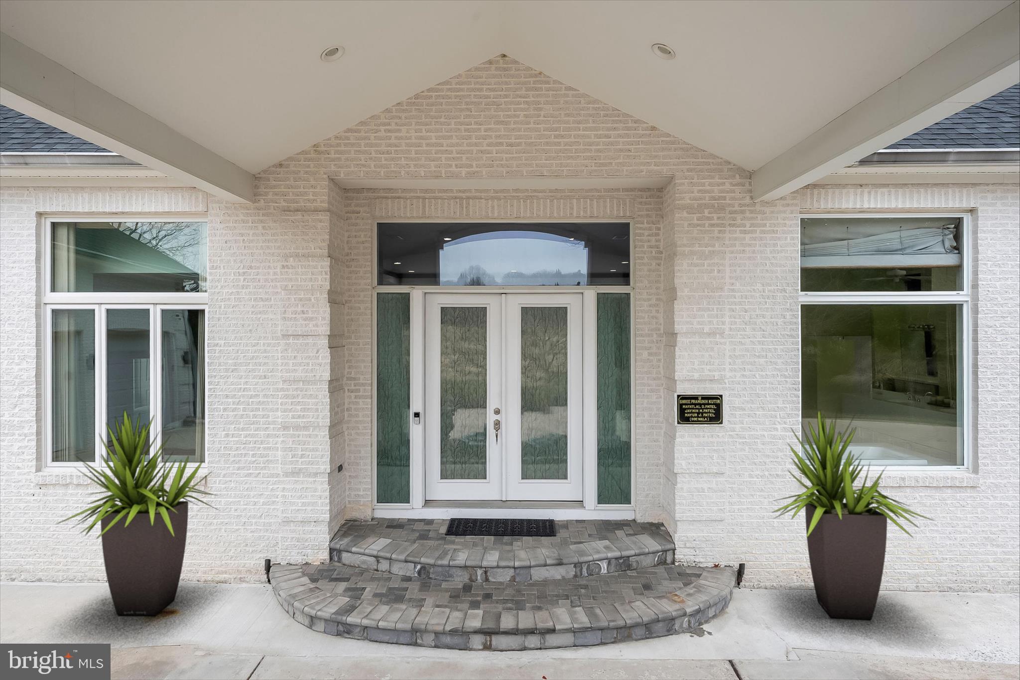 11678 Frederick Road Ellicott City, MD 21042 - Photo 10 of 118 a view of a house with a potted plant