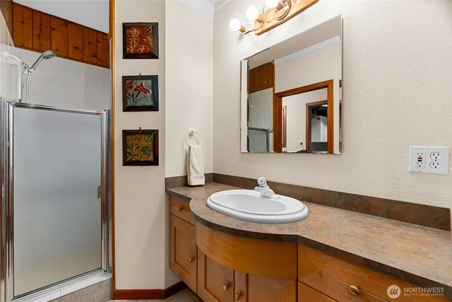 a bathroom with a sink and a mirror