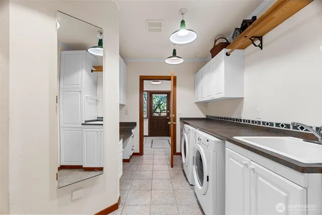 a kitchen with a refrigerator and a sink