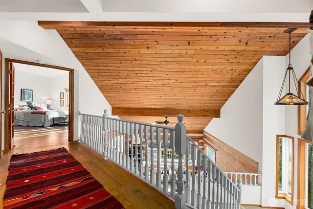 a view of balcony with wooden floor and seating space