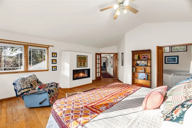 a bedroom with a large bed and a couch