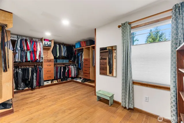 a room with wooden floor and furniture