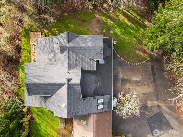 a front view of a house with yard and green space
