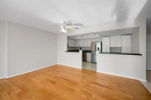 a view of a kitchen with wooden cabinet and a kitchen island