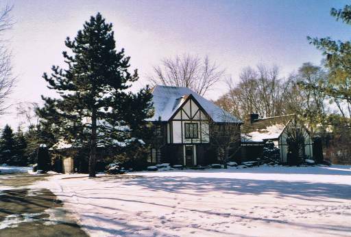 393 Bradwell Road Inverness, IL 60010 - Photo 1 of 1 a front view of a house with a yard and garage