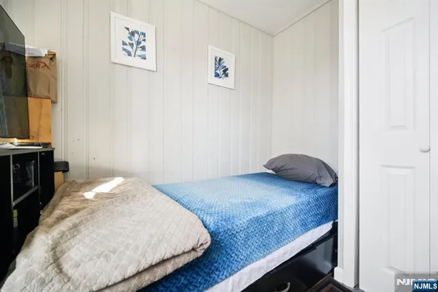 a bedroom with a bed and a table