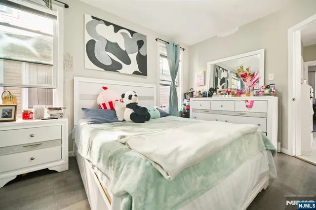 a bedroom with a bed and closet