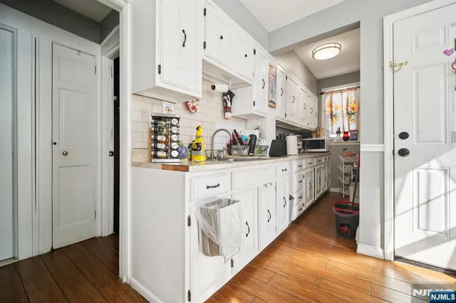 a kitchen with stainless steel appliances a refrigerator and a stove