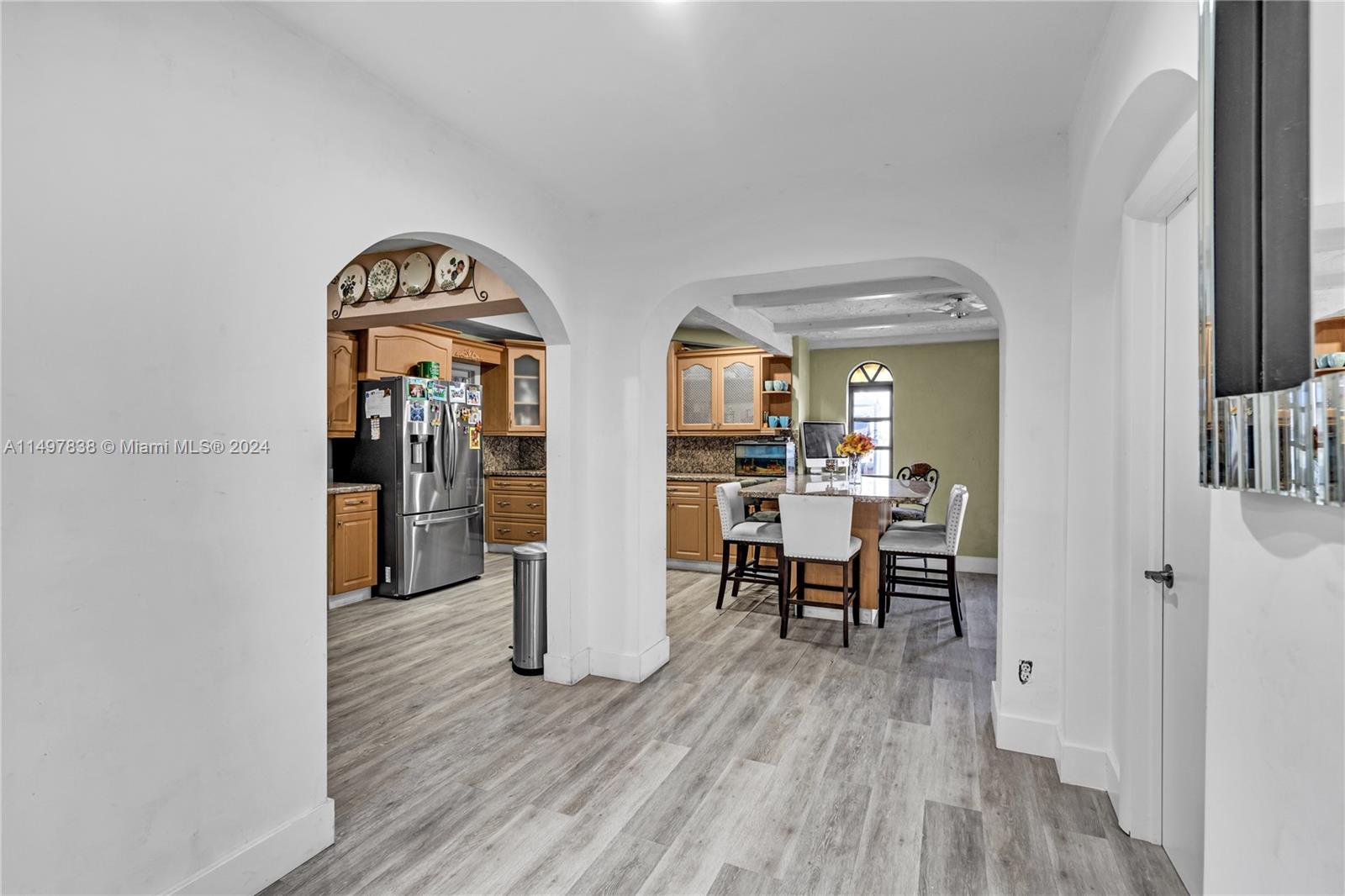 10981 Southwest 44th Street Miami, FL 33165 - Photo 14 of 52 a view of a livingroom with furniture and wooden floor