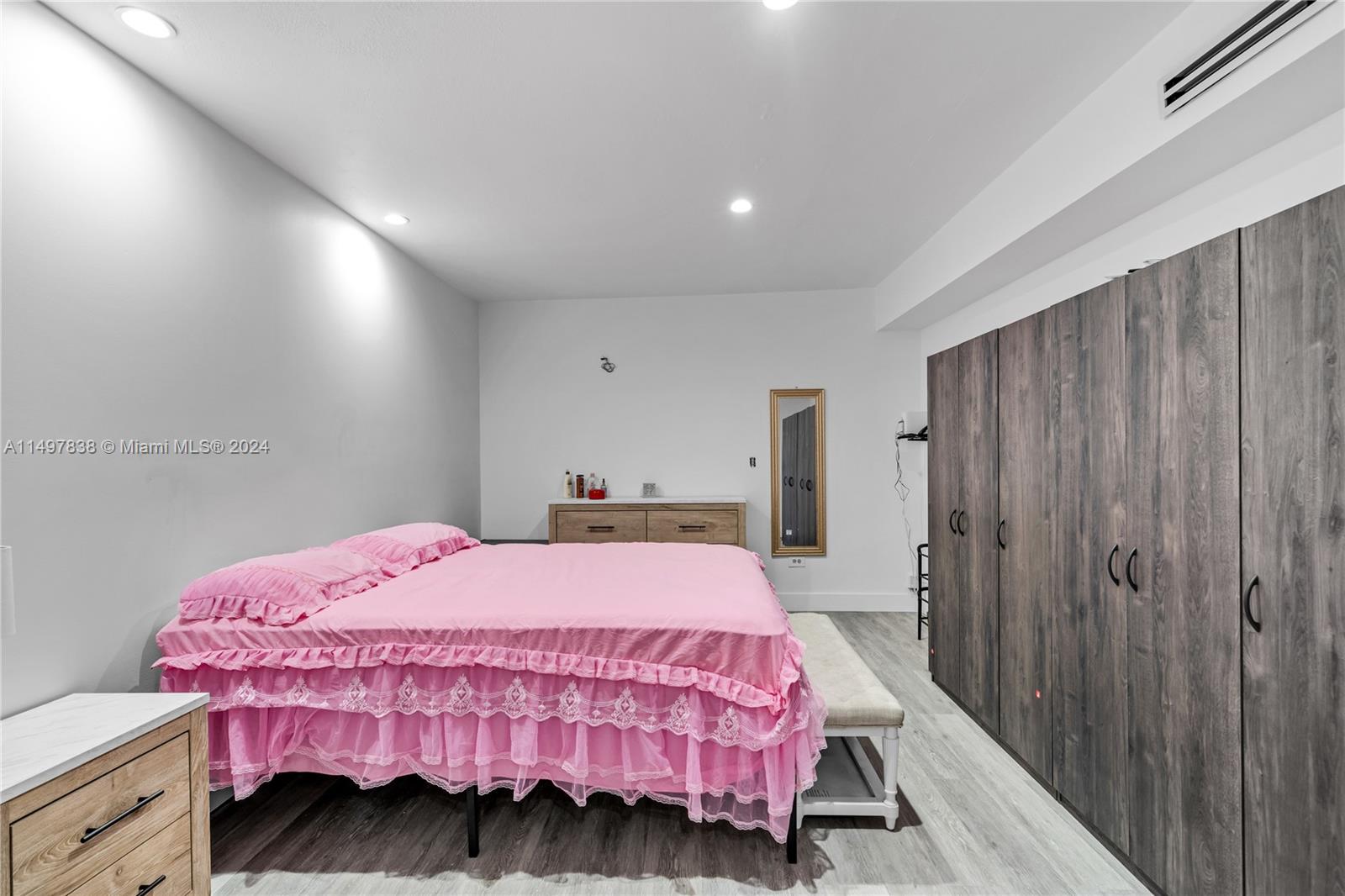 10981 Southwest 44th Street Miami, FL 33165 - Photo 20 of 52 a bedroom with a bed and a closet