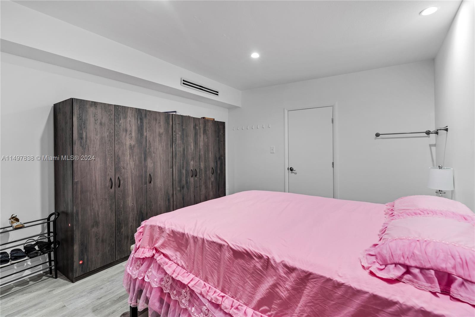 10981 Southwest 44th Street Miami, FL 33165 - Photo 21 of 52 a bedroom with a bed and a closet