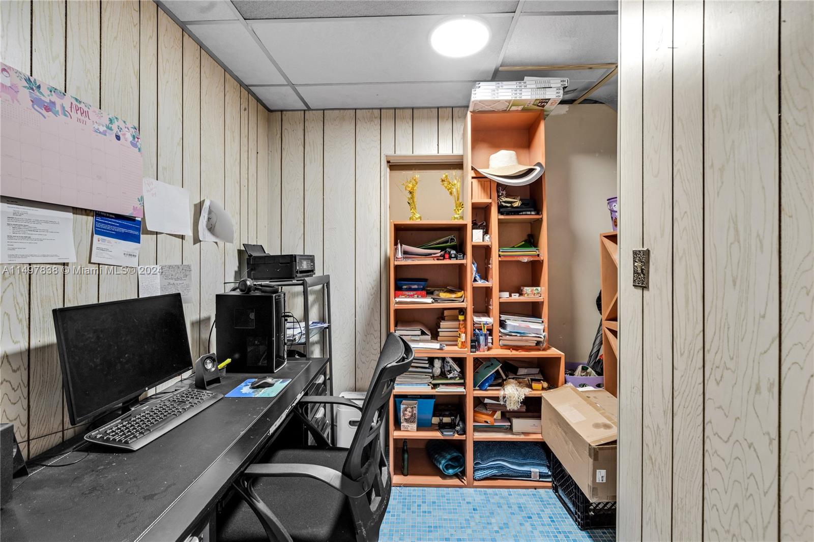 10981 Southwest 44th Street Miami, FL 33165 - Photo 30 of 52 a view of a workspace with furniture and a window