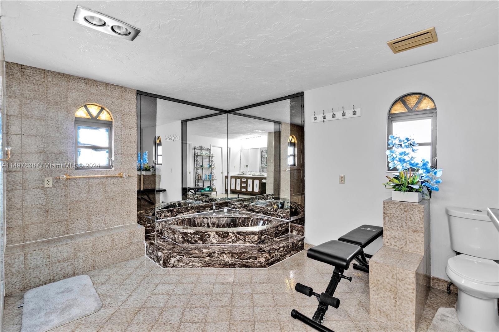 10981 Southwest 44th Street Miami, FL 33165 - Photo 38 of 52 a living room with furniture and a large window