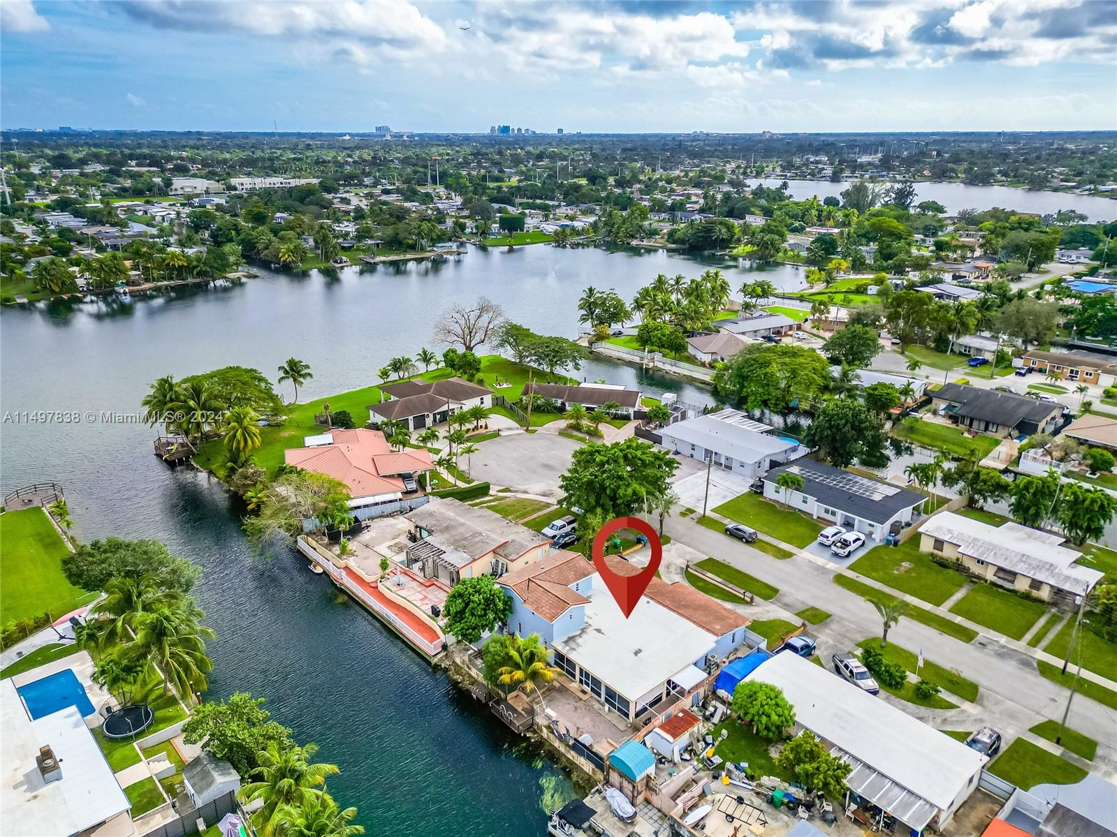 10981 Southwest 44th Street Miami, FL 33165 - Photo 4 of 52 an aerial view of a house with a lake view