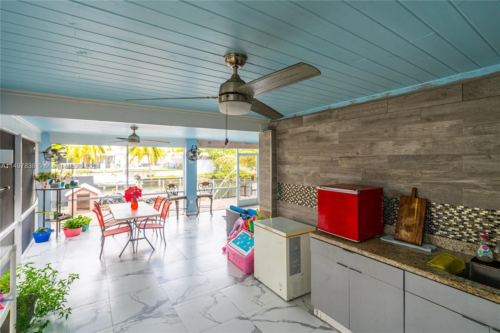 10981 Southwest 44th Street Miami, FL 33165 - Photo 41 of 52 an outdoor space with seating