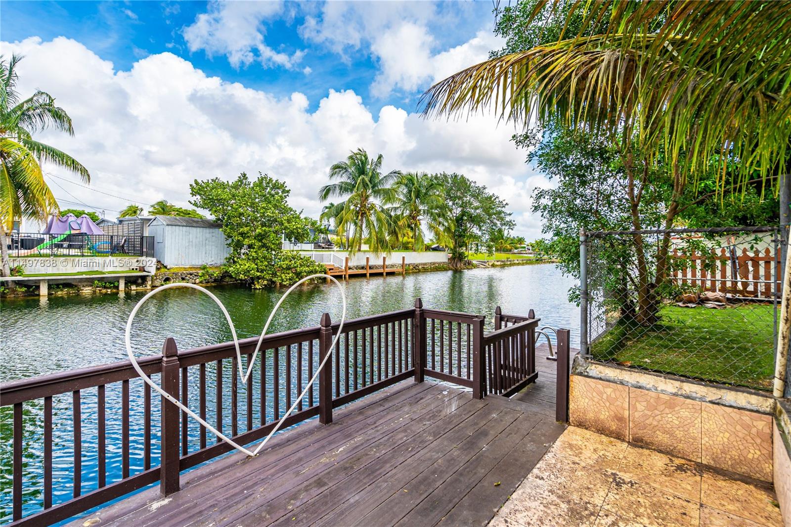10981 Southwest 44th Street Miami, FL 33165 - Photo 46 of 52 a view of a roof deck with wooden fence