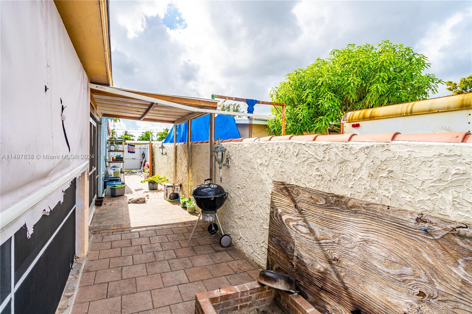 10981 Southwest 44th Street Miami, FL 33165 - Photo 49 of 52 a terrace view with seating space