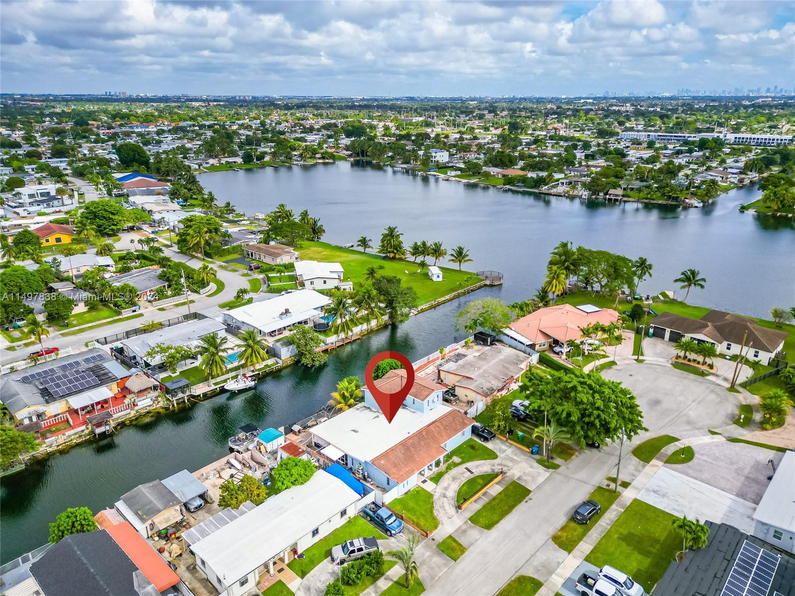 10981 Southwest 44th Street Miami, FL 33165 - Photo 5 of 52 an aerial view of lake and residential houses with outdoor space