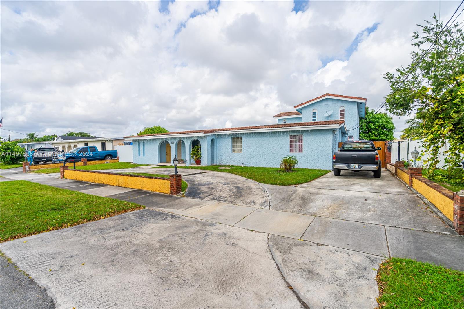 10981 Southwest 44th Street Miami, FL 33165 - Photo 8 of 52 a view of a house with swimming pool and a yard