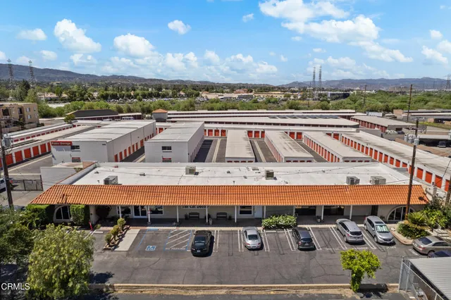 an aerial view of a swimming pool with a yard