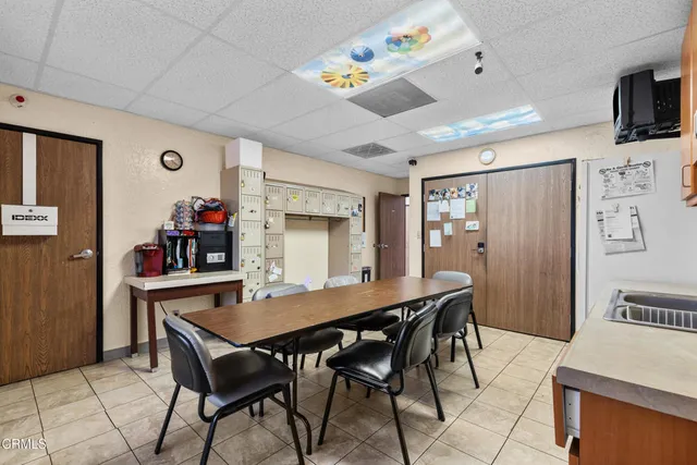 a bedroom with a bed and a book shelf