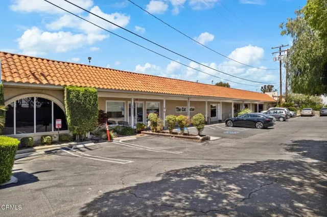 a view of a building with sitting area