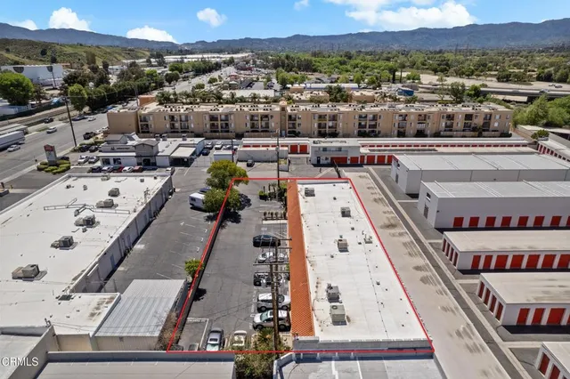 an aerial view of residential houses with street