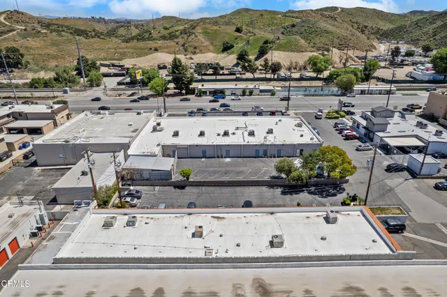 a room with lots of books and a large window