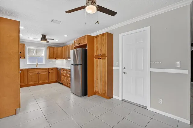 a kitchen with stainless steel appliances a refrigerator and a sink