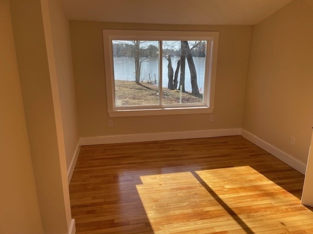 35 Lawrence Road Dudley, MA 01571 - Photo 9 of 17 a view of empty room with wooden floor and fan