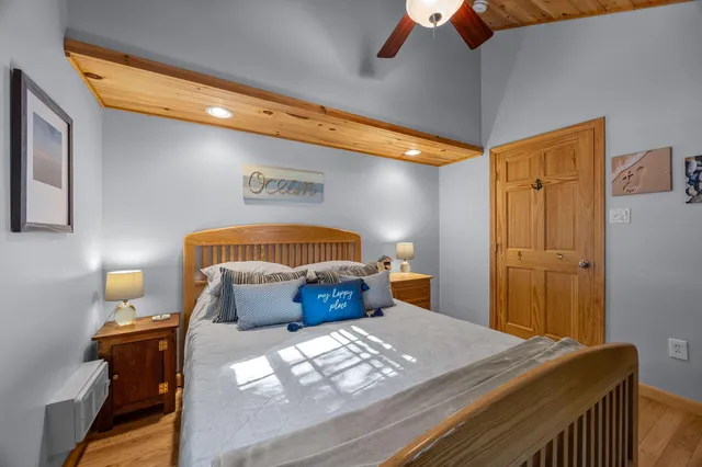 a bedroom with a bed and lamp