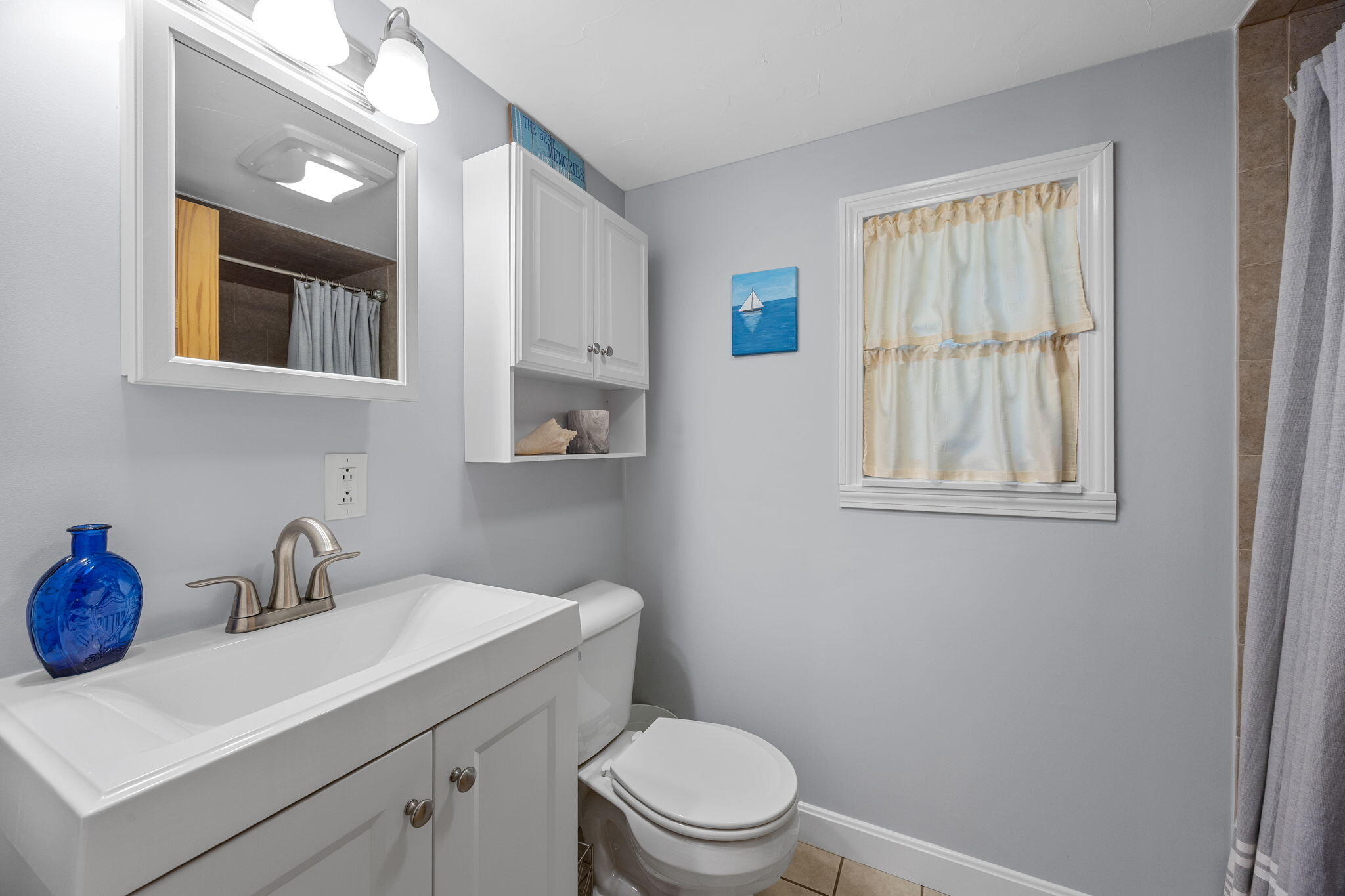 2032 State Hwy Route, Unit F/ (6) Wellfleet, MA 02667 - Photo 17 of 37 a bathroom with a toilet a sink and mirror