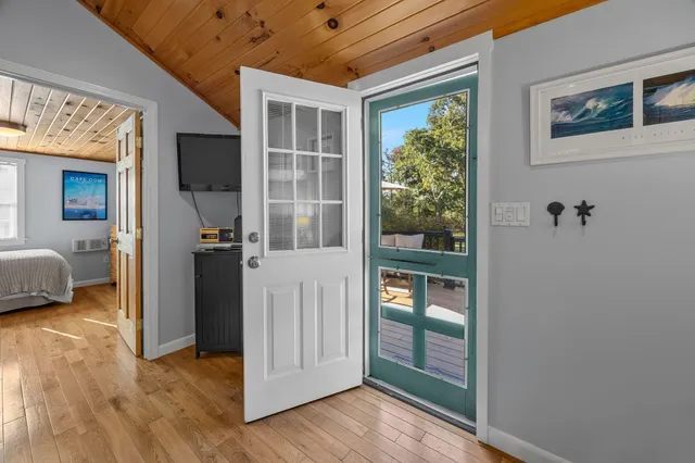 a view of a livingroom with furniture and front door