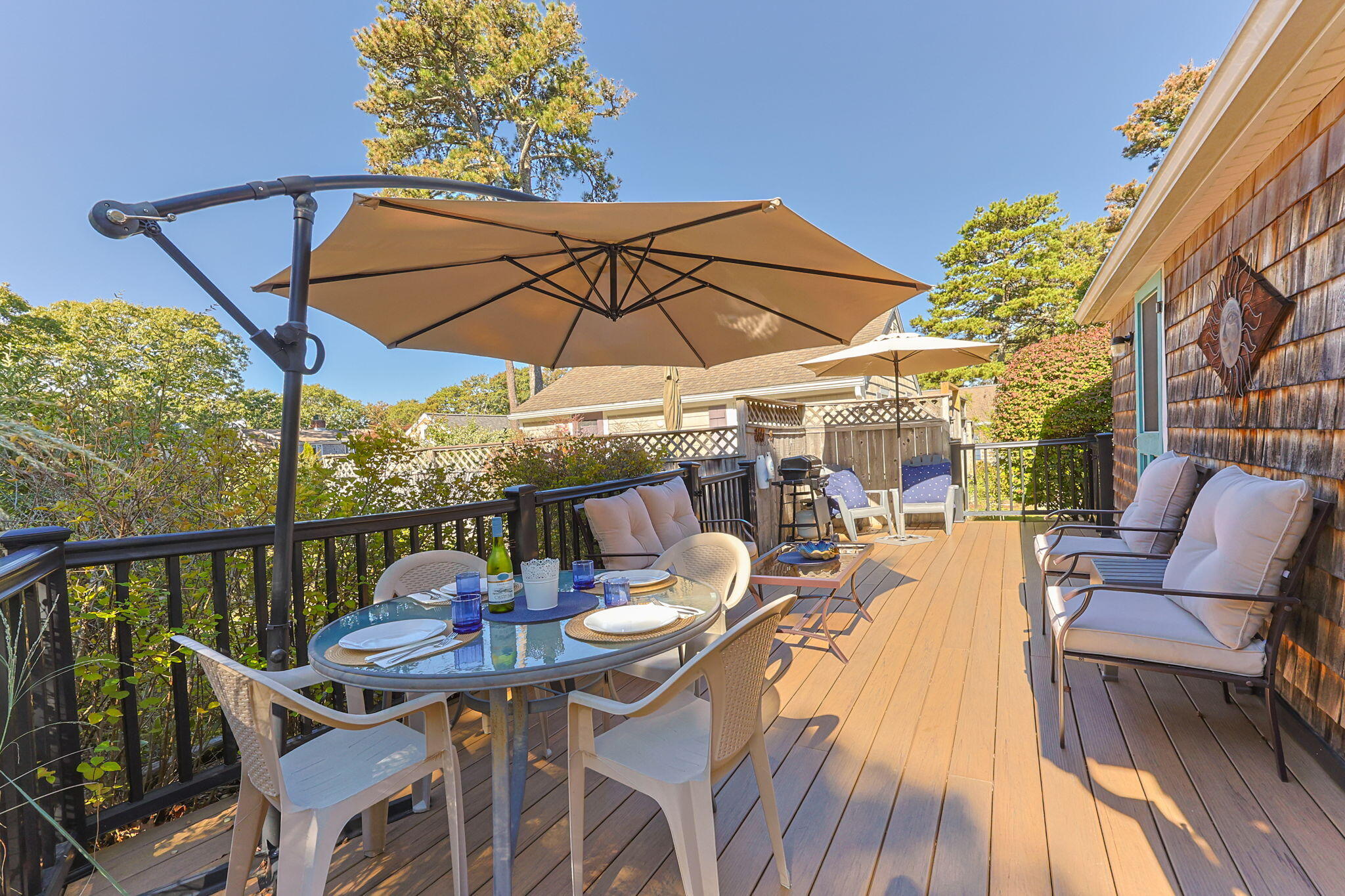 2032 State Hwy Route, Unit F/ (6) Wellfleet, MA 02667 - Photo 20 of 37 a view of a patio with furniture and a umbrella