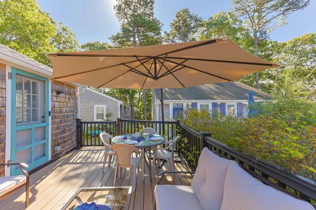 a balcony view with a seating space