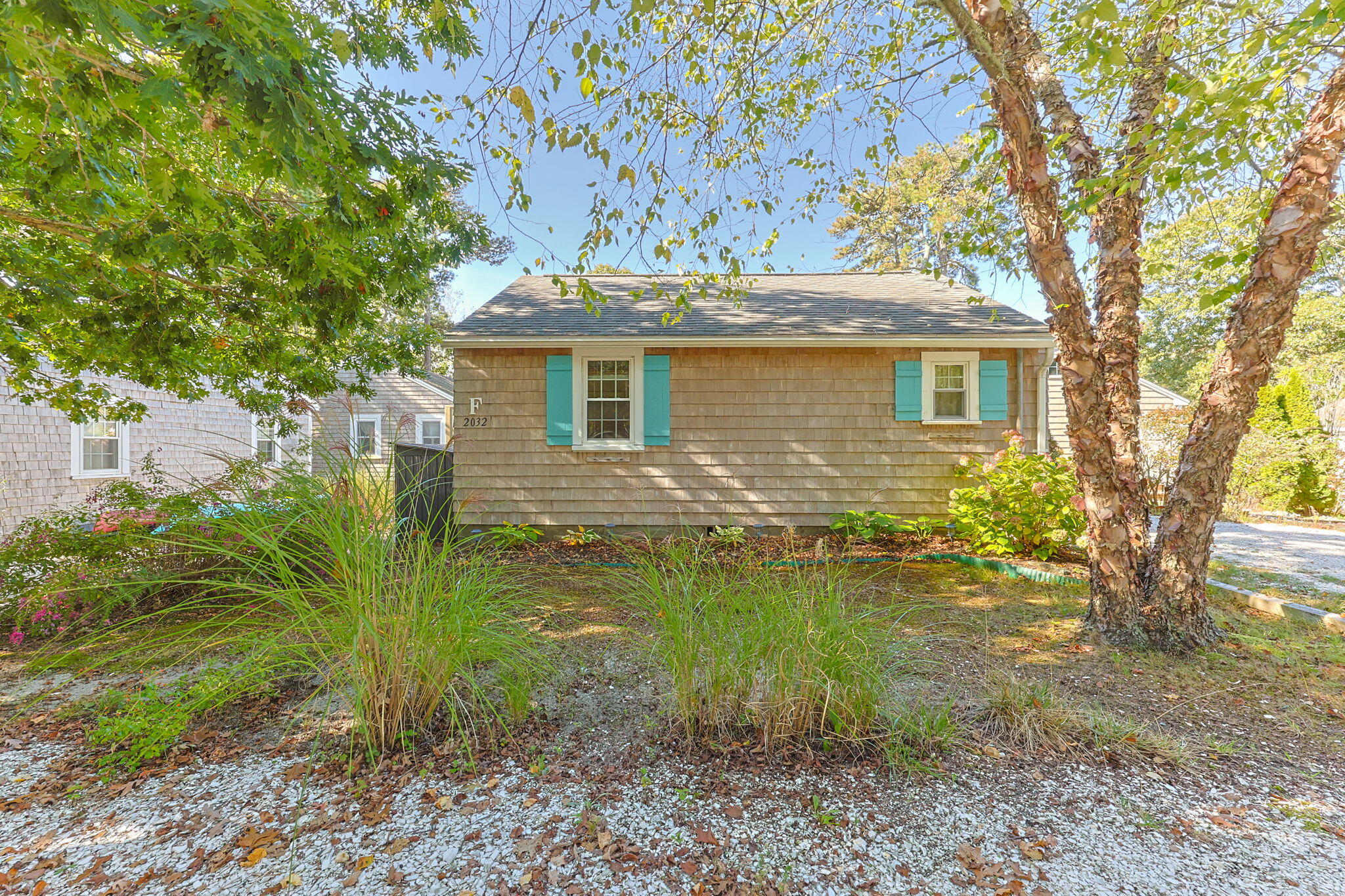 2032 State Hwy Route, Unit F/ (6) Wellfleet, MA 02667 - Photo 25 of 37 a backyard of a house with lots of green space