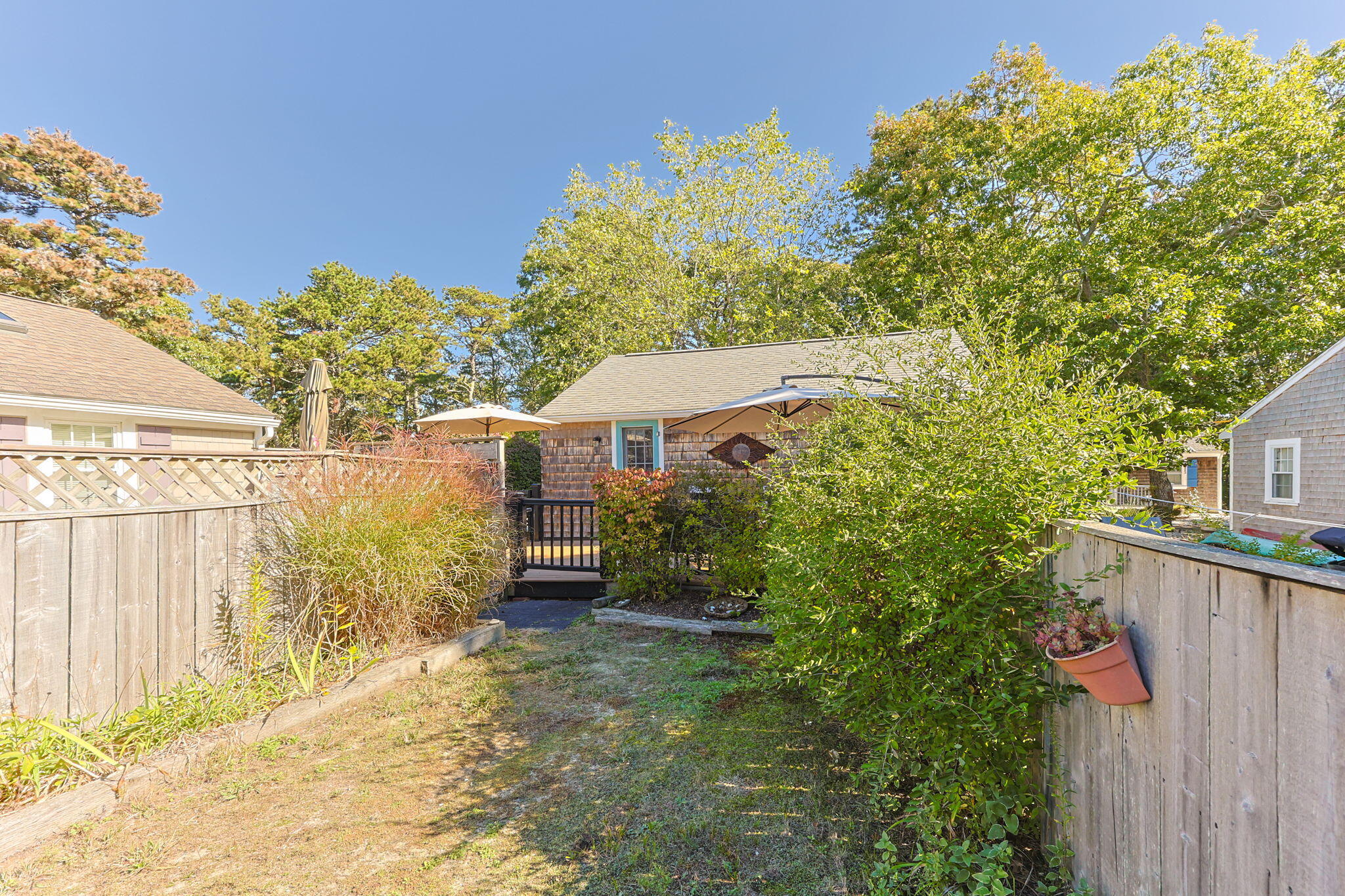 2032 State Hwy Route, Unit F/ (6) Wellfleet, MA 02667 - Photo 30 of 37 a view of a house with a backyard