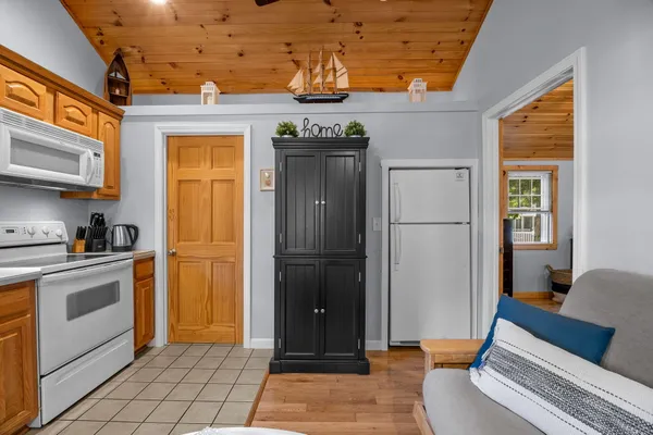 a kitchen with stainless steel appliances granite countertop a refrigerator and a stove