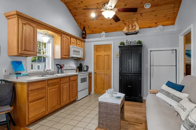 a kitchen with a refrigerator and a sink