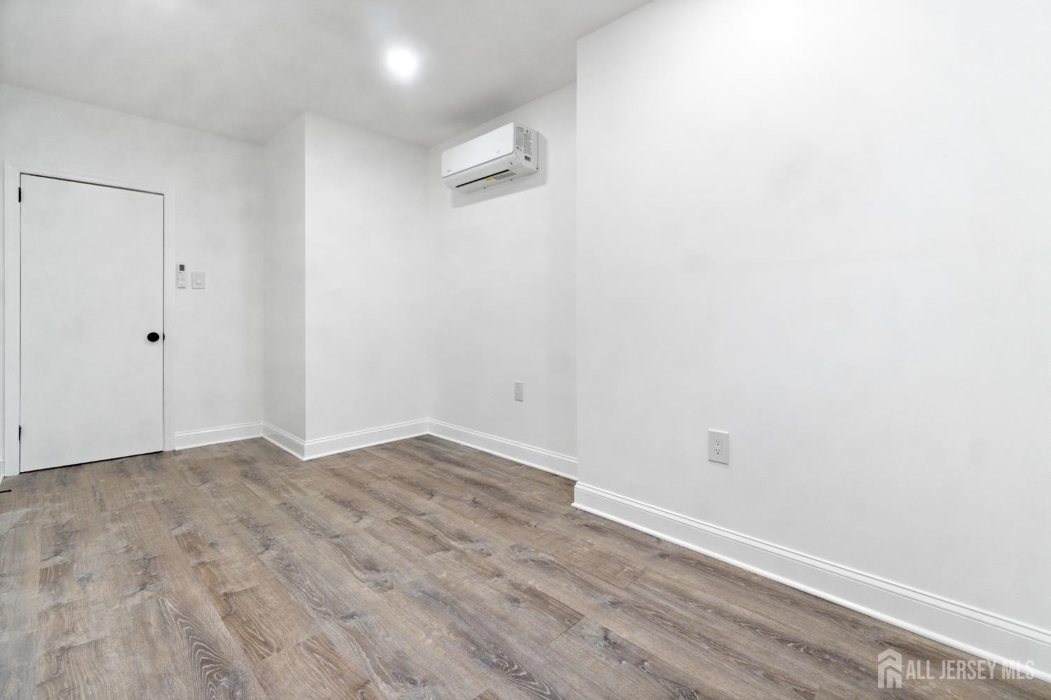 427 Benner Street, Unit 2 Highland Park, NJ 08904 - Photo 14 of 18 a view of small space with wooden floor