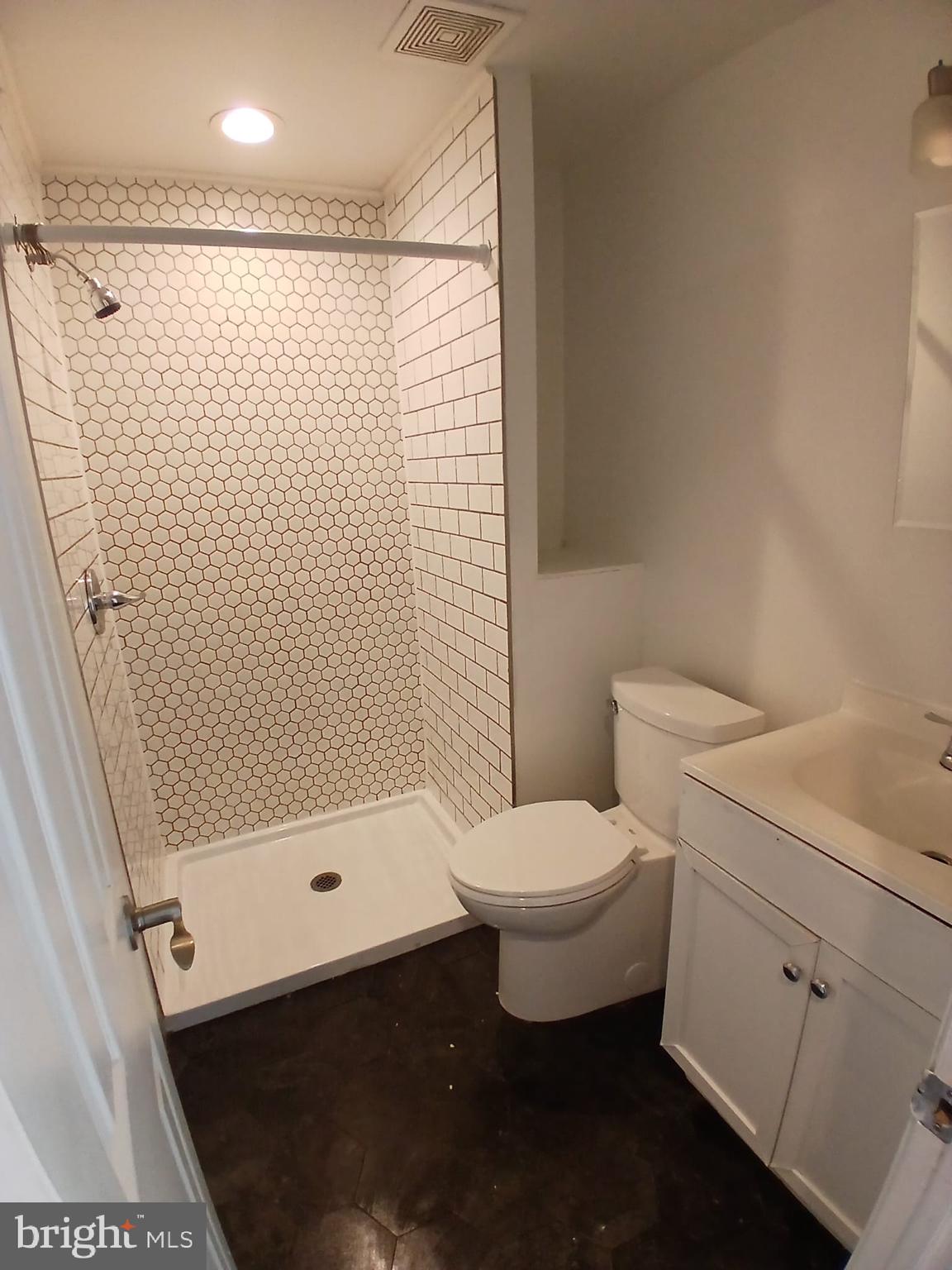 4511 Laird Street Philadelphia, PA 19139 - Photo 12 of 20 a bathroom with a toilet and a shower