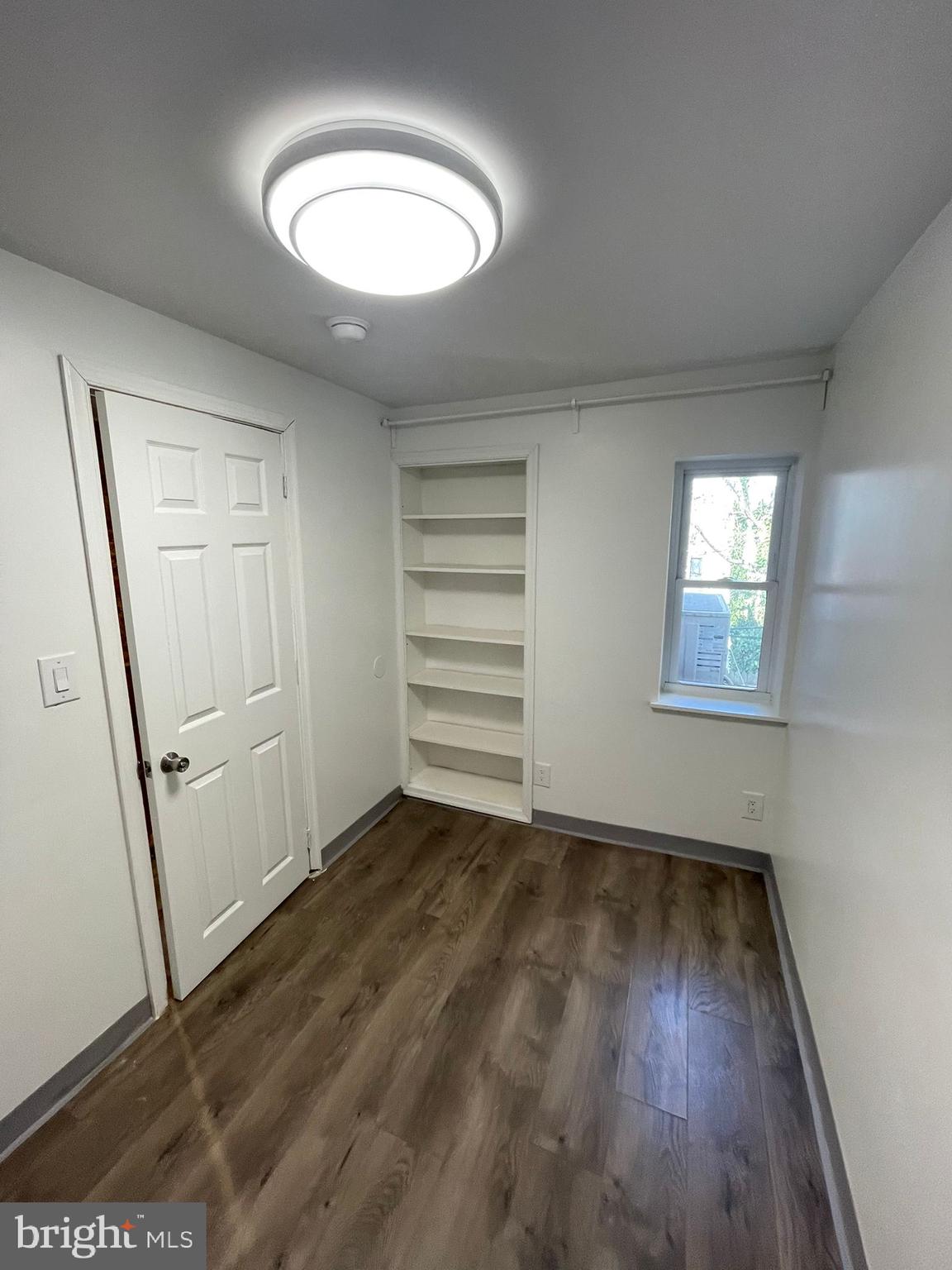 4511 Laird Street Philadelphia, PA 19139 - Photo 13 of 20 an empty room with wooden floor and windows
