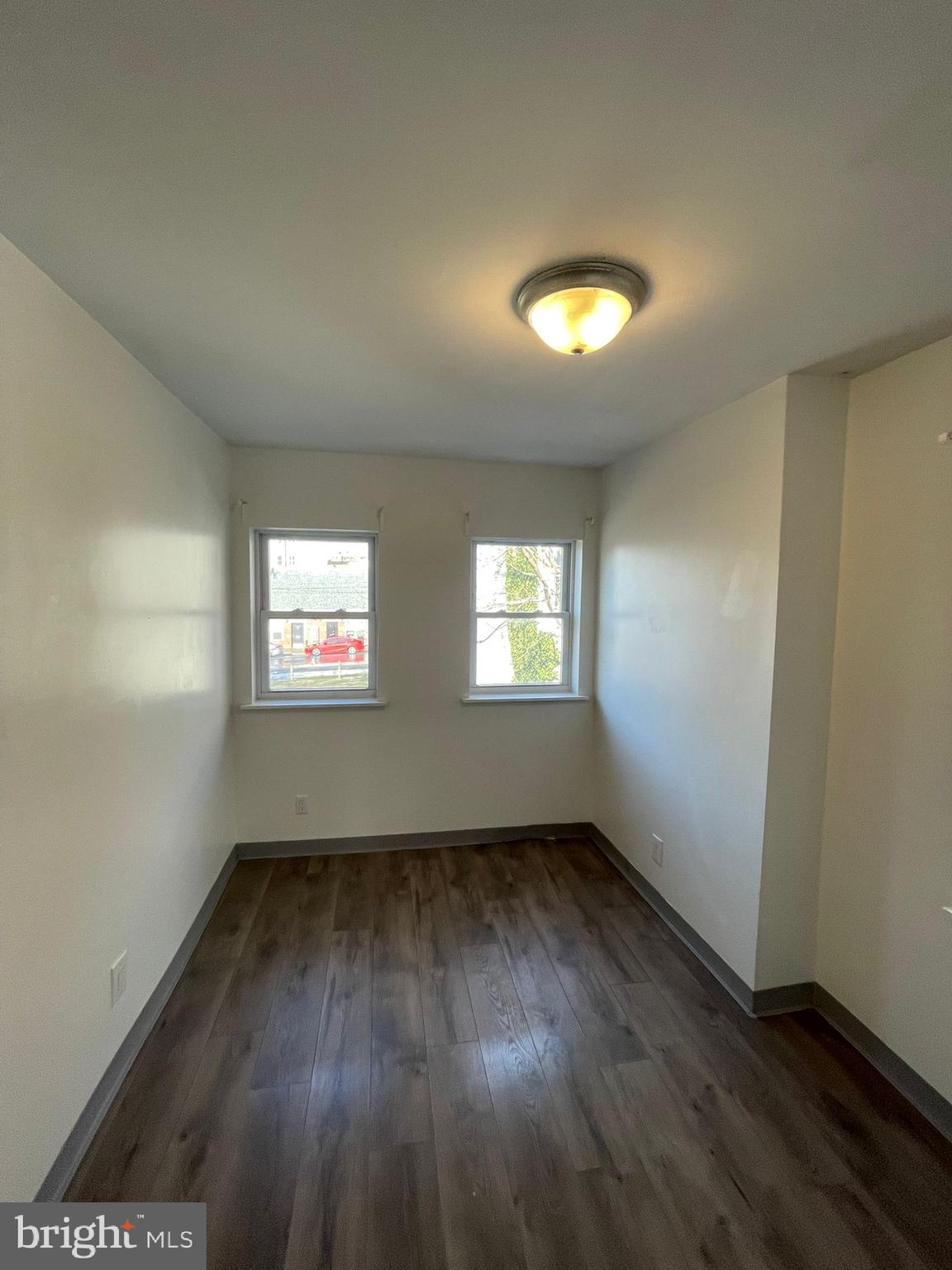 4511 Laird Street Philadelphia, PA 19139 - Photo 16 of 20 an empty room with wooden floor and windows