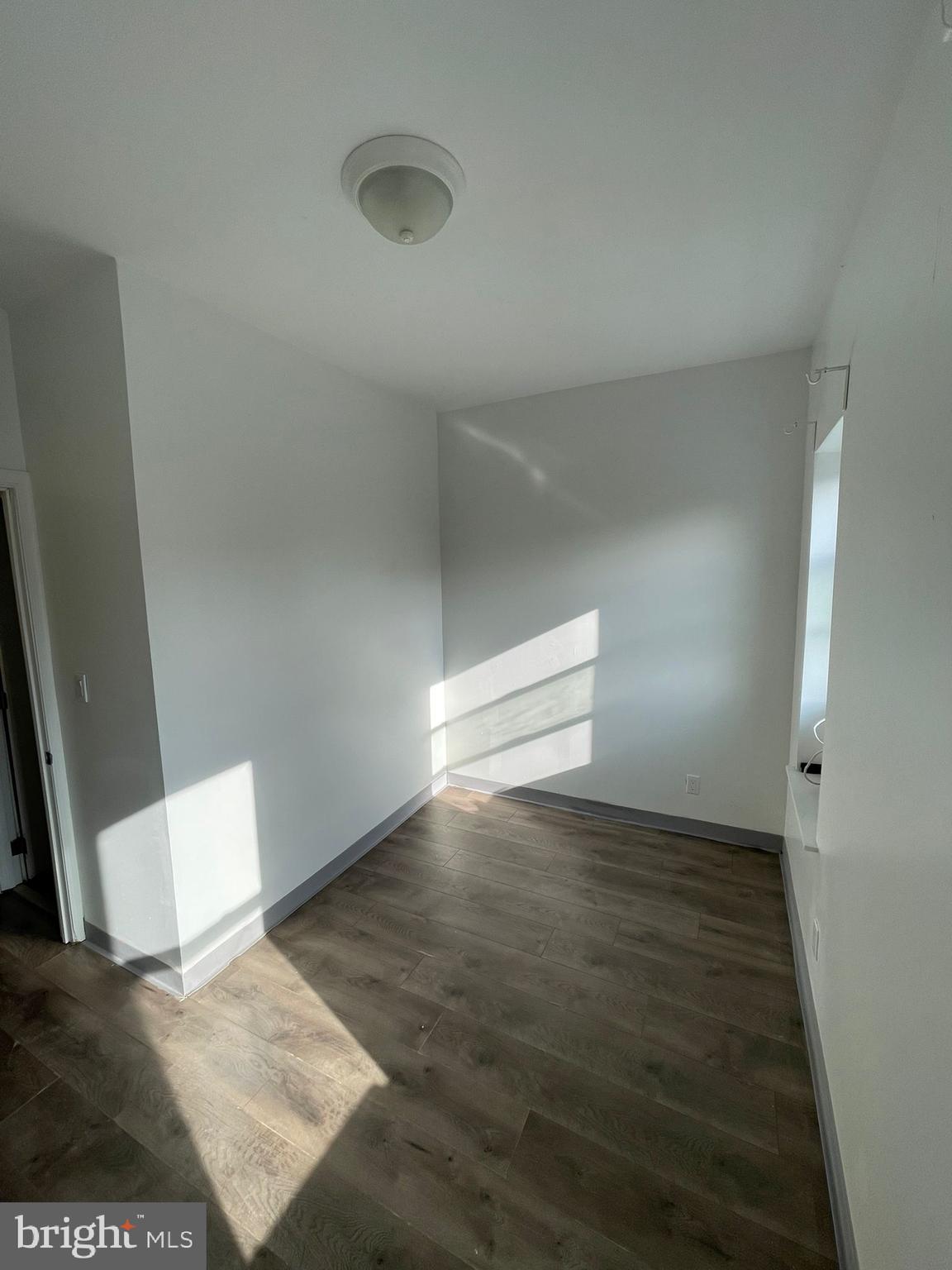 4511 Laird Street Philadelphia, PA 19139 - Photo 17 of 20 a view of an empty room and wooden floor