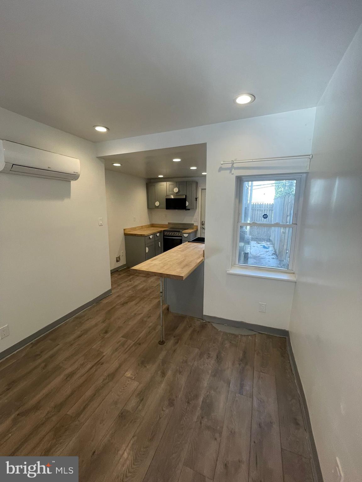 4511 Laird Street Philadelphia, PA 19139 - Photo 3 of 20 an empty room with wooden floor and windows