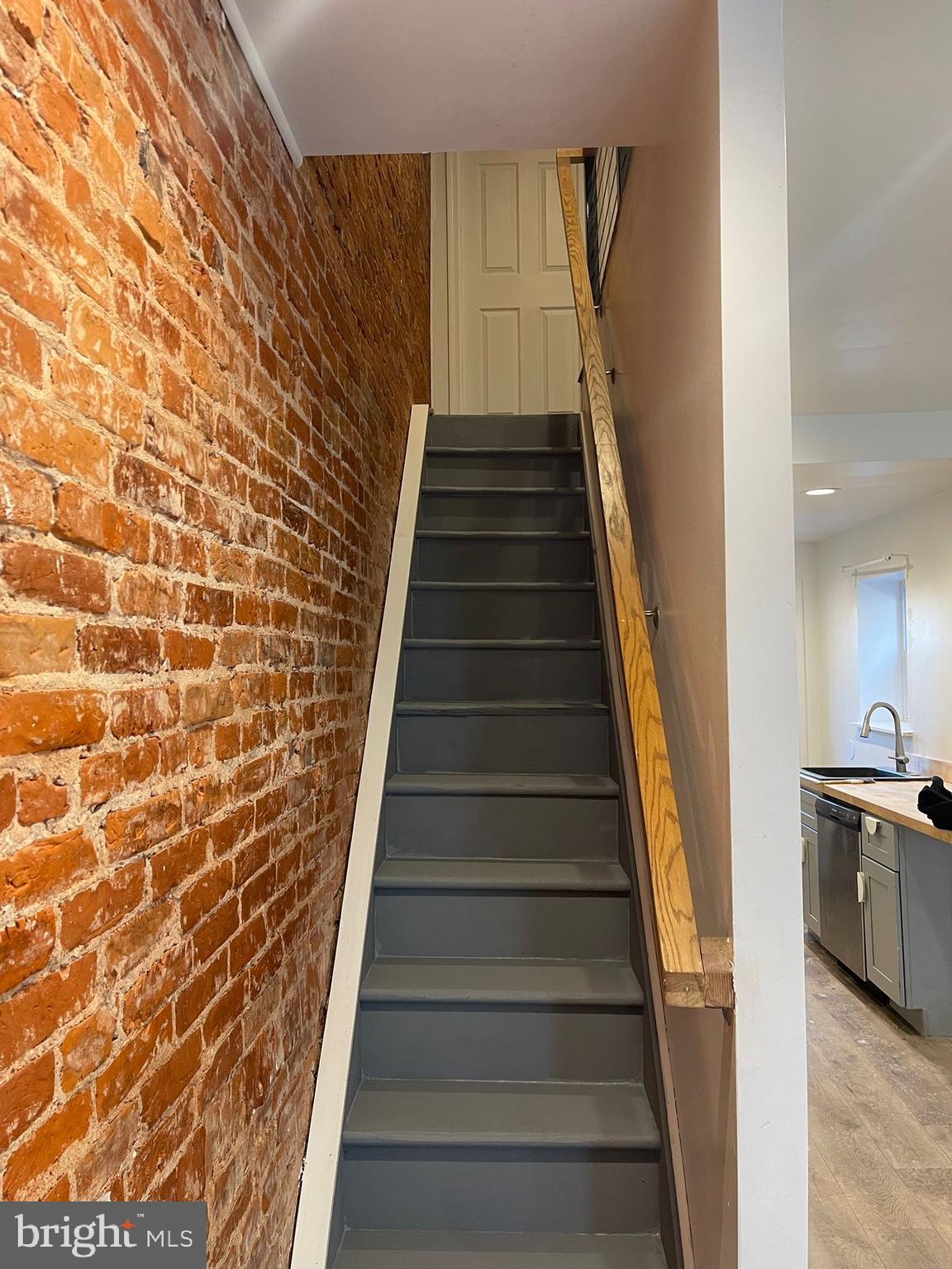4511 Laird Street Philadelphia, PA 19139 - Photo 10 of 20 a view of a hallway with wooden floor and stairs