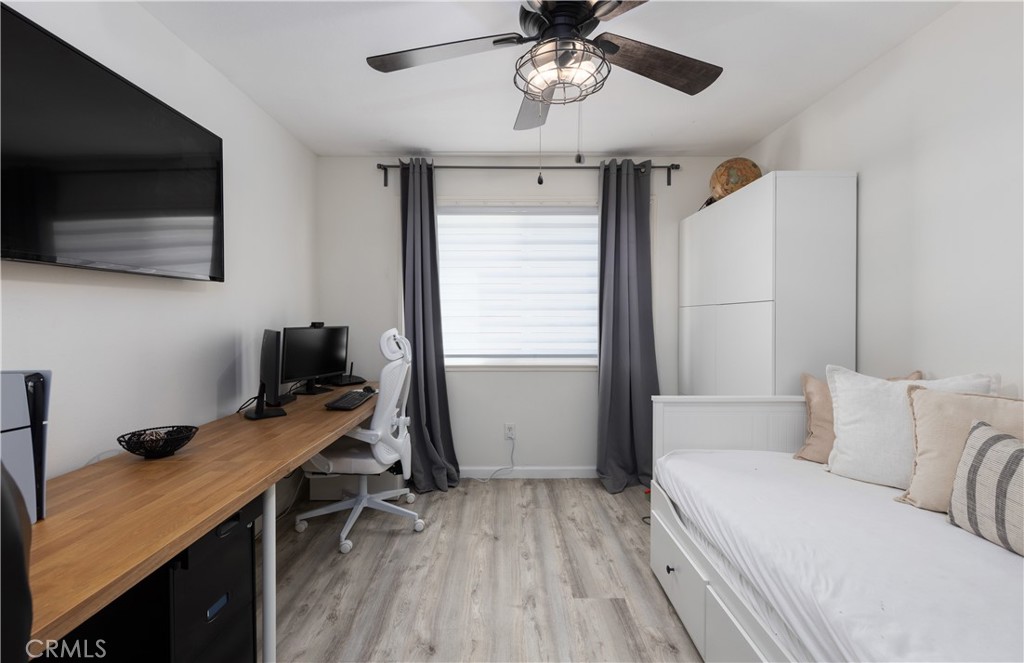 12200 Montecito Road, Unit D104 Seal Beach, CA 90740 - Photo 13 of 25 a bedroom with a workspace