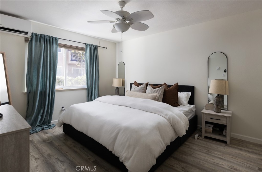 12200 Montecito Road, Unit D104 Seal Beach, CA 90740 - Photo 15 of 25 a bedroom with bed and a window